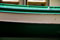 green and white boat on Venice canal